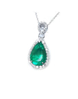 5.83 ct. pear-cut Colombian emerald pendant with diamond halo in 18K white gold.