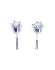 Pair of 14K white gold natural diamond stud earrings with six-prong settings and screw backs.