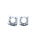 A pair of diamond stud earrings white gold, topside view.