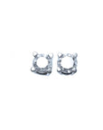 A pair of diamond stud earrings white gold, topside view.