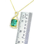 Genuine Colombian emerald necklace square emerald-cut sourced from the Muzo mine in Colombia, weighing 0.98 carats, halo diamond