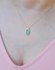 Colombian emerald jewelry for women necklace sourced from the Muzo mine in Colombia, weighing 0.98 carats, halo diamond 14k yellow gold