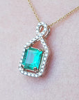 14k Yellow gold emerald and diamond necklace square emerald-cut Muzo mine in Colombia, weighing 0.98 carats, halo diamond
