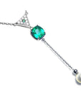 Cushion cut natural emerald necklace with freshwater pearl danglin, crafted in 14k white gold