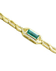 14K yellow gold bracelet with a vibrant emerald-cut natural Colombian emerald and accent diamonds.