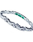 White gold bracelet with vibrant Colombian emeralds and princess cut diamonds.