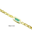 Back view of a 14K yellow gold bracelet with a rectangular emerald-cut green emerald.