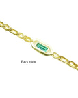 Back view of a 14K yellow gold bracelet with a rectangular emerald-cut green emerald.
