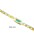 Back view of a 14K yellow gold bracelet with a rectangular emerald-cut green emerald.