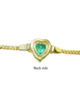 Back of a 14K yellow gold bracelet with a heart-shaped emerald.