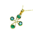 18K yellow gold cross pendant with four round Colombian emeralds and a central diamond.