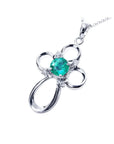 0.57 ct. round Colombian emerald cross pendant in 14K white gold with diamond accents.