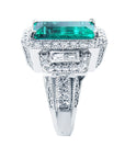 Top and side profile view of a brides May birthstone emerald ring in white gold.