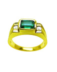 Men's 14K yellow gold ring with a bezel-set emerald and side diamond accents.