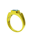 This gold emerald ring for men shows the top setting and partial side of the band design.
