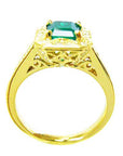 This is a yellow gold emerald ring for women on a lateral position top and gallery view.