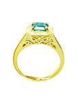 This is a yellow gold emerald ring for women on a lateral position top and gallery view.