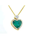 18k gold heart pendant with a large bluish-green emerald haloed by diamonds on a delicate chain.