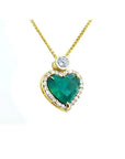 18k gold heart pendant with a large bluish-green emerald haloed by diamonds on a delicate chain.