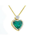 18k gold heart pendant with a large bluish-green emerald haloed by diamonds on a delicate chain.