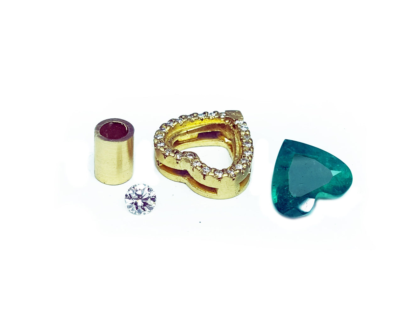 Gold mounting on the rough with heart cut emerald and diamond to be set.