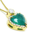 Gold necklace with a heart-shaped emerald pendant on a side profile gallery view.