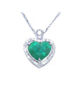 2.64 carat natural emerald heart pendant in 14K white gold, framed by diamonds on a delicate chain.