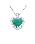 2.64 carat natural emerald heart pendant in 14K white gold, framed by diamonds on a delicate chain.