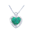 2.64 carat natural emerald heart pendant in 14K white gold, framed by diamonds on a delicate chain.