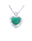 2.64 carat natural emerald heart pendant in 14K white gold, framed by diamonds on a delicate chain.