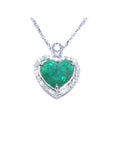 2.64 carat natural emerald heart pendant in 14K white gold, framed by diamonds on a delicate chain.