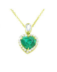 14K yellow gold heart pendant with a medium-deep green emerald and diamond halo on a delicate chain.