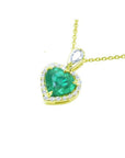 14K yellow gold heart pendant with a deep green emerald and diamond halo.