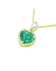 14K yellow gold heart pendant with a deep green emerald and diamond halo.