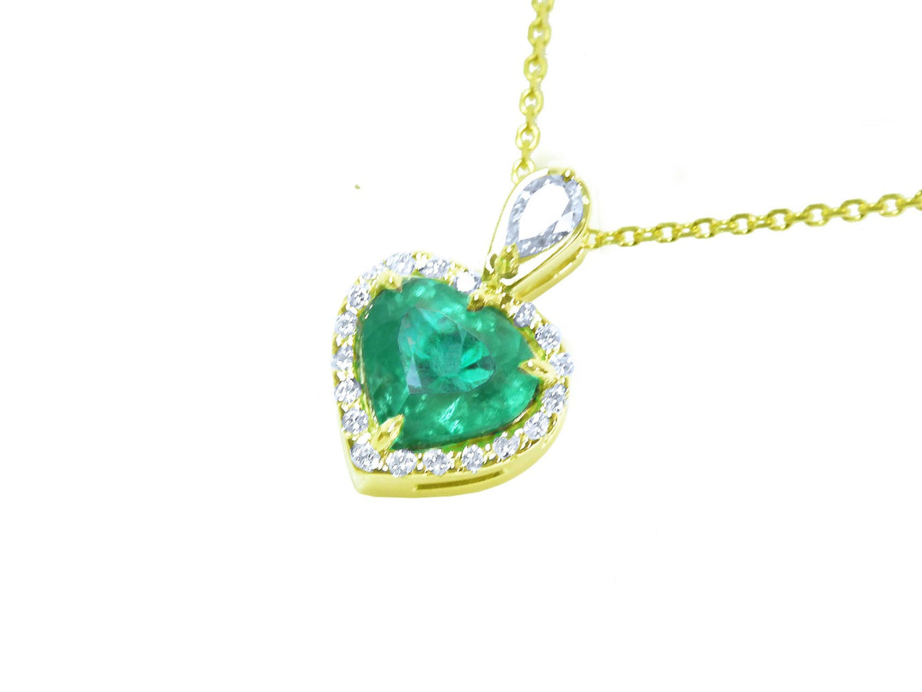 Gold pendant with a heart-shaped emerald and halo diamonds on a white background.