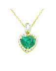 14K yellow gold heart pendant with a medium-deep green emerald and diamond halo on a delicate chain.
