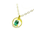 14k yellow gold necklace with an oval 0.85 ct natural Colombian emerald and diamond accents.
