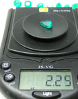 Natural emerald pear cut from muzo mine Colombia, on electronic scale weight