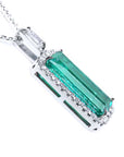 An elongated emerald pendant with side galley view.