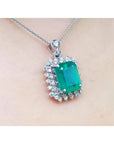 7.78 ct. natural emerald pendant with deep green rectangular stone, double halo diamonds, 14K white gold, antique style.