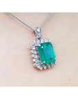 7.78 ct. natural emerald pendant with deep green rectangular stone, double halo diamonds, 14K white gold, antique style.