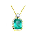 7.09 ct. natural emerald pendant with diamond halo and round purple gemstone on 18K yellow gold chain.