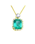 7.09 ct. natural emerald pendant with diamond halo and round purple gemstone on 18K yellow gold chain.