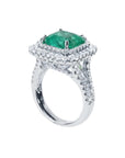 4.14 ct GIA F1 Colombian emerald ring with bright green emerald, diamond halo, and diamond-accented 14K white gold band.