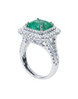 4.14 ct GIA F1 Colombian emerald ring with bright green emerald, diamond halo, and diamond-accented 14K white gold band.