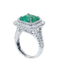 4.14 ct GIA F1 Colombian emerald ring with bright green emerald, diamond halo, and diamond-accented 14K white gold band.