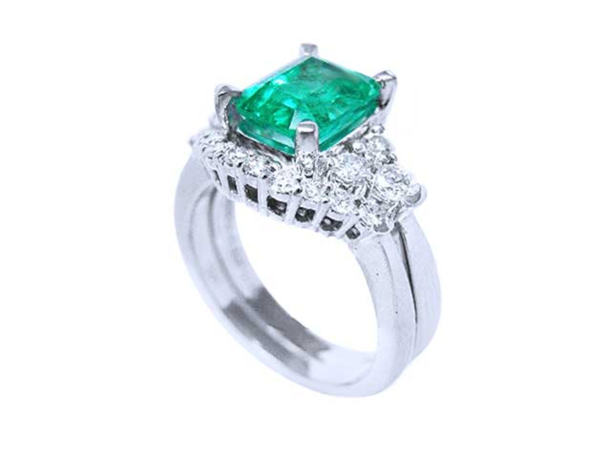 A partial lateral profile view of the emerald on top with side diamonds ring with matching band together.