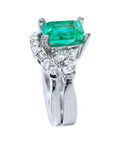 Side profile of the square emerald on top, side diamonds and band ring with the matching band together.
