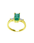 1.05 ct natural emerald ring with side baguette diamonds in 14K yellow gold.