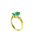 1.05 ct. natural emerald ring with side baguette diamonds in 14K yellow gold.
